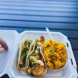 Pulled pork taco. Fish taco. Yellow rice