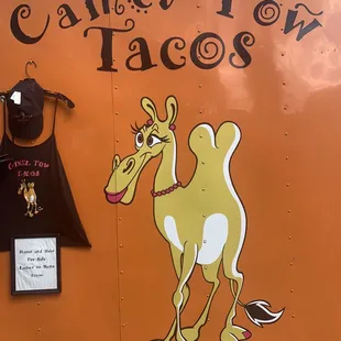 a camel on the side of a truck
