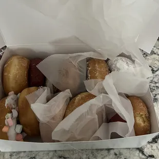 I got a dozen. My favorite had to be the glaze and chocolate sprinkles but they were all delicious
