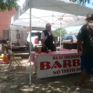 a man selling barbecues
