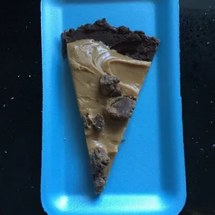 a slice of chocolate cake on a blue plate