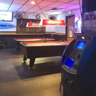 2 pool tables inside