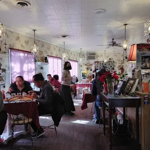 diners sitting at tables in a cafe