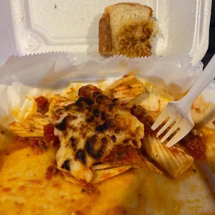 Half eaten mostaccioli. The broiled cheese was an add on!