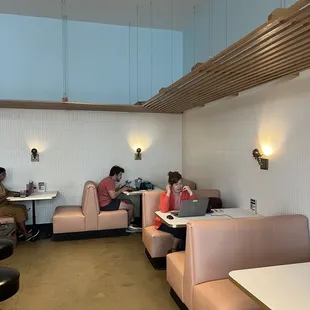 two people working on laptops in a restaurant