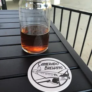 a glass of beer on a table