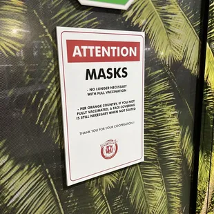 a sign warning of masks