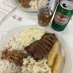 Steak Fried Yuka Rice and beans  Potato salad Broccoli risotto