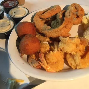 Fried catfish strips, shrimp, crab legs, &amp; hush puppies.