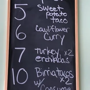 a menu on a chalkboard