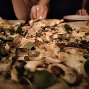 a pizza with mushrooms and cheese