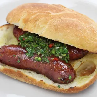 a sausage sandwich on a bun