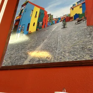 a picture of a street with colorful houses