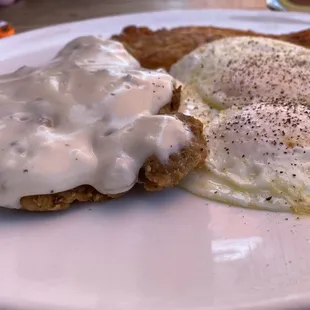 Chicken fried steak with hash and overeasy eggs