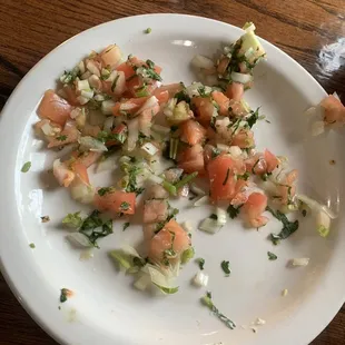 A plate a of old Pico De Gallo that they charged me $4.20