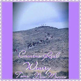 a group of people walking up a hill