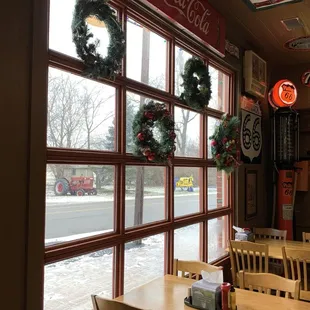 Interior Xmas wreaths with views of tractors