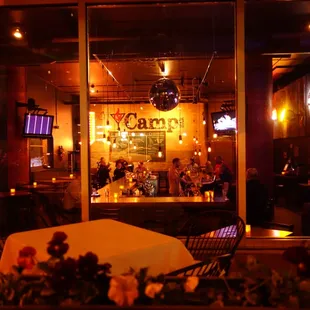a table and chairs in front of a window