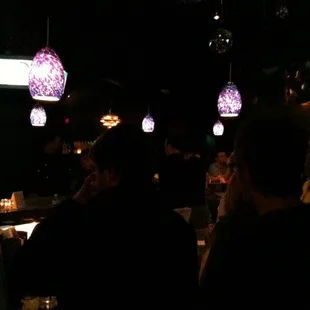 a group of people sitting at a bar