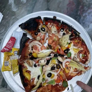 Amateur hour at the pizza oven. Burnt on one edge, uncooked on the other. This is what $30 gets you...can't even feed two adults