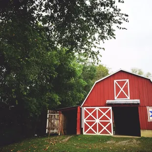 a red barn with a quilt on the door