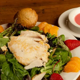 Warm Grilled Chicken Mixed greens, grilled chicken, strawberries, mandarin oranges, sliced almonds and raspberry vinaigrette.