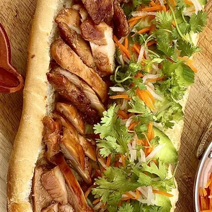 Grilled Lemongrass Jidori Chicken Banh mi with fresh in-house baked baguette