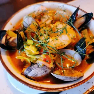 Bouillabaisse with rock fish, mussels, clams in a  light tomato broth
