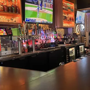 a bar with a lot of bottles of alcohol