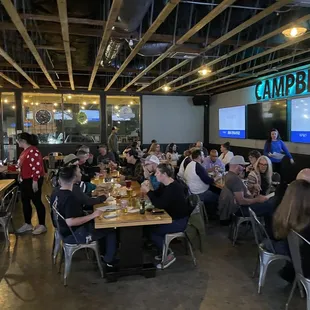 a large group of people sitting at tables