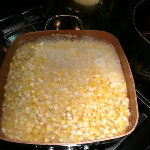 a pan of cooked corn