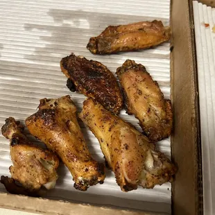 The wings were burnt to hell so they flipped them to hide it