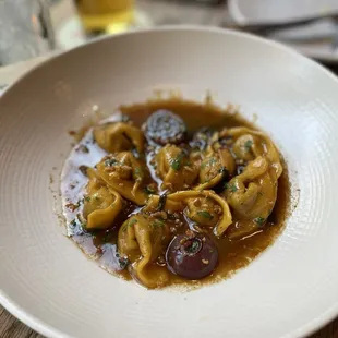 Liberty Duck Confit Pansotti, Charred Onion + Marsala Sauce, Swiss Chard