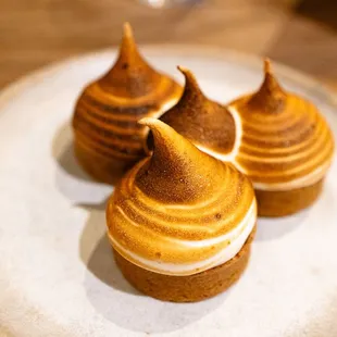 three desserts on a white plate