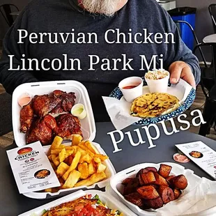 a man sitting at a table full of food