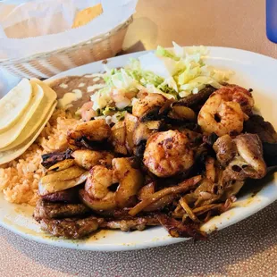 Steak and shrimp corn tortillas and refried beans amazing