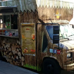 a man standing in front of a food truck