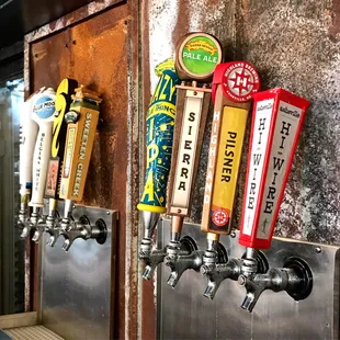 a row of beer taps