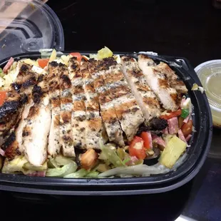 Chopped salad: Diced Salami, Provolone, Black and Green Olives, Tomatoes, Artichoke Hearts Tossed with Lettuce and our Italian Dressing