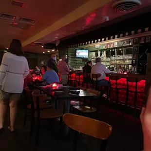 people sitting at the bar
