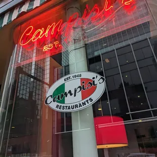 a reflection of a sign in the window
