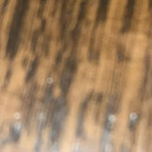 a blurry image of a wooden table