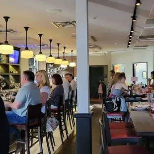 people sitting at the bar