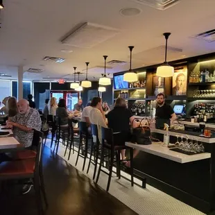 people sitting at the bar