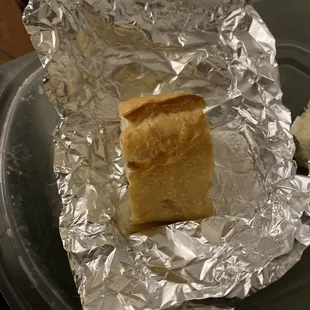 One of the two tiny pieces of bread. Gosh, don't hurt yourselves with that one!