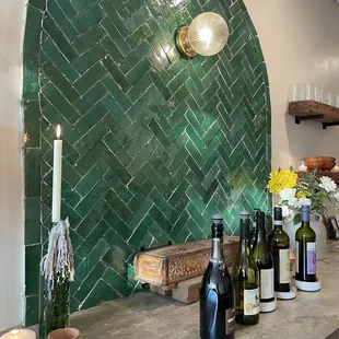 Love the back wall, so many candles and fresh florals