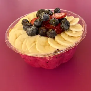 a bowl of fruit on a table