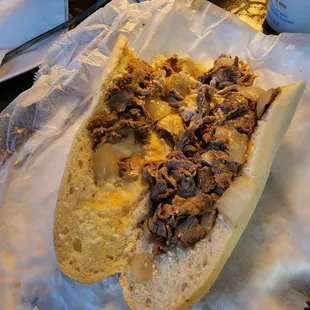 a sandwich with meat and cheese