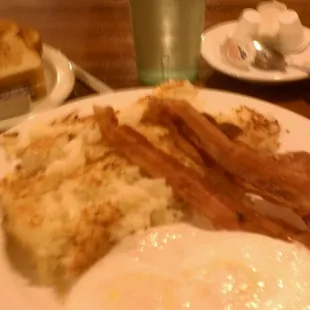 bacon, hash browns, eggs and toast
