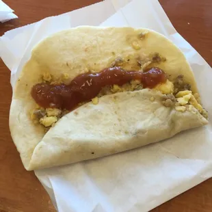 Breakfast taco. Egg and sausage with hot sauce